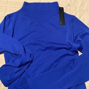 Woman blue top very stretchy size L but will fit S & M too